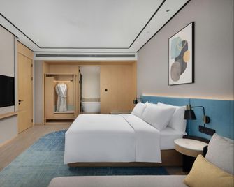 Hilton Garden Inn Rizhao High-Tech Zone - Rizhao - Slaapkamer