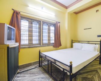 Spot On 60539 Sristty Hotel & Lodge - Krishnanagar - Bedroom