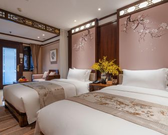 Doof Resort Hotel - Lijiang - Schlafzimmer