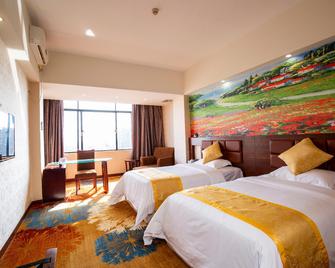 Venice Holiday Hotel - Maoming - Bedroom