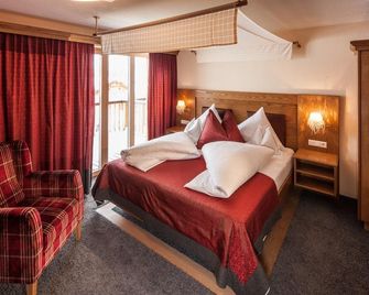 Hotel & Chalet Montana - לך אם ארלברג - חדר שינה