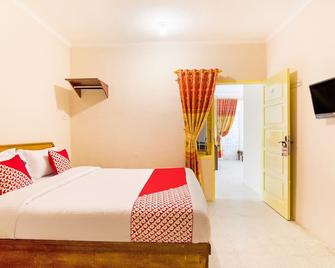 Hotel O Lansano Residence Syariah - Padang - Schlafzimmer
