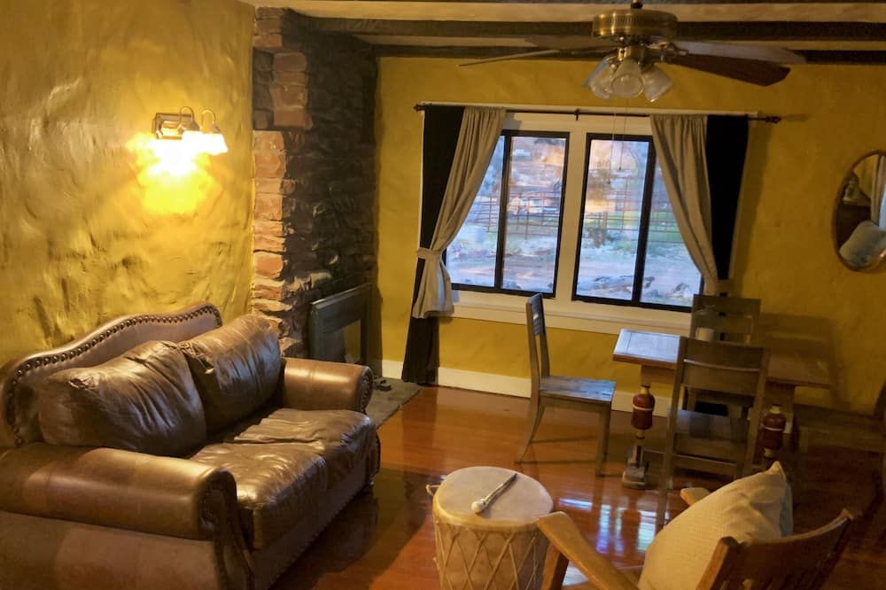 Living room view of 1930's Stone Cottage with spectacular views!