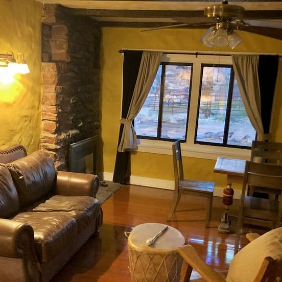 Living room view of 1930's Stone Cottage with spectacular views!