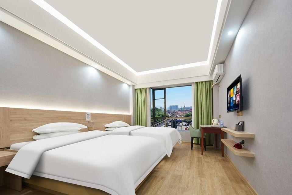 Heyi Business Hostel - שנג'ן - חדר שינה