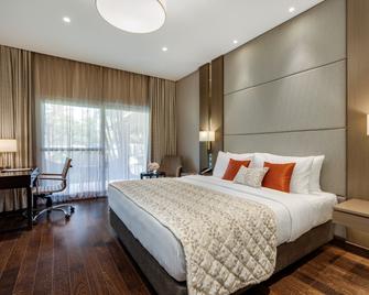 Palm Meadows Resort - באנגאלור - חדר שינה