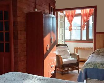 Hostal Casa Florencia - פוארטו ואראס - חדר שינה