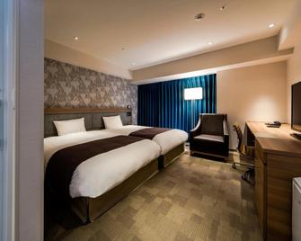 دايوا روينت هوتل توكوشيما ستيشن - توكوشيما - غرفة نوم