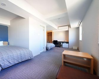 Hotel Hishiya - קארויזאווה - חדר שינה