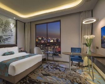 Xiangsheng Xinyi Hotel (Liansheng Happy City Jiujiang No.3 Middle School) - Jiujiang - Schlafzimmer
