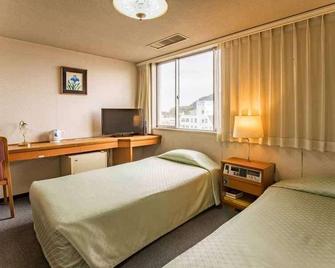 Kawanoe Business Hotel - Shikokuchuo - Camera da letto