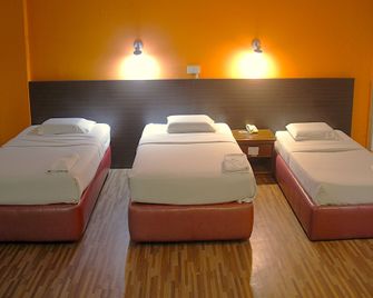 Hotel O Hotel Ramai - סאנדאקן - חדר שינה