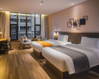 Oriental Xuanwu Hotel - Yancheng - Camera da letto