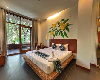 Monsoon Riverside Hotel - Nom Pen - Habitación