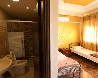 Sun Rise Hotel & Hostel & Tours - עמאן - חדר שינה