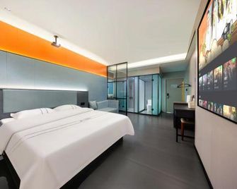 Next Wisdom Hotel - Wanning - Bedroom