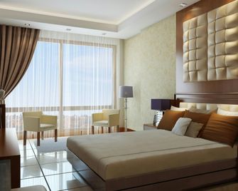 كين بلازا أرجان باي روتانا - كينشاسا - غرفة نوم