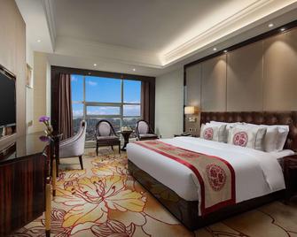 Ramada by Wyndham Chenzhou - Chenzhou - Schlafzimmer