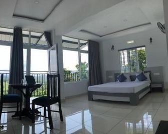 Raveendra Inn - Kalpetta - Bedroom