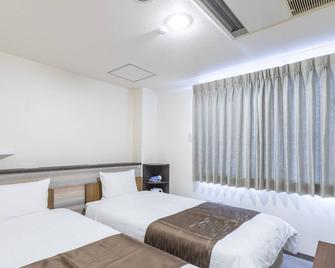 Tabist business hotel New Gekkoen - Takamatsu - Slaapkamer