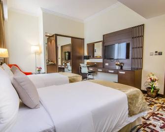 Al Murooj Grand Hotel - Muscat - Bedroom
