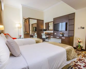 فندق المروج جراند - مسقط - غرفة نوم