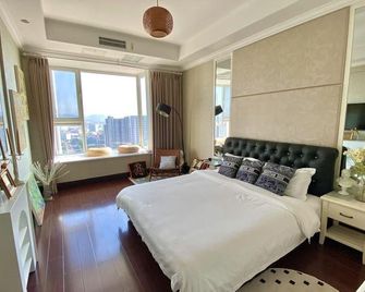 Boze Seaview Holiday Apartment (Weihai International Bathing Beach Torch 8th Street Shop) - Weihai - Sypialnia