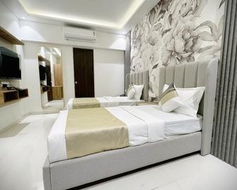 The Orion Premium Suites - Mumbai - Schlafzimmer