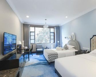 Leshan Jinhaitang Hotel - Leshan - Habitación