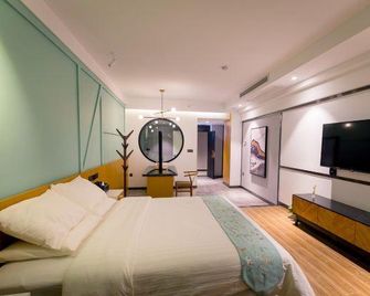 Q+ Mantingfang Inn (Zhangjiajie Railway Station Tianmenshan) - Zhangjiajie - Camera da letto