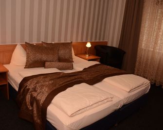 هوتل بريتشيرسبيتز - ميونخ - غرفة نوم