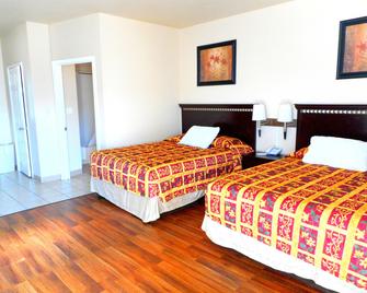 Crossroads Inn & Suites - Victoria - Kamar Tidur