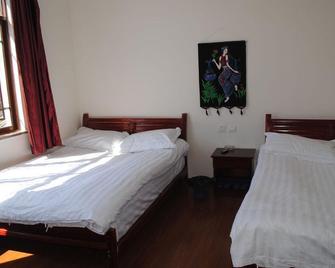 Lijiang Peach Hostel - Lijiang - Bedroom