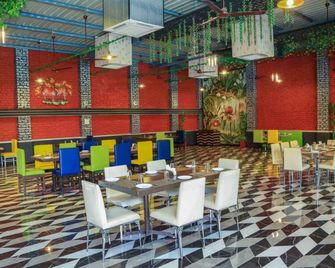 Oriental Palace Resort - אודאיפור - מסעדה