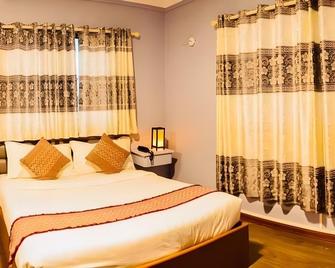 Thiha Bala Hotel - Pyin Oo Lwin - Camera da letto