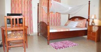Uhuru 50 Hotel - Kasese - Bedroom