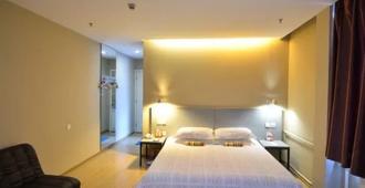 Luoyang Aviation E-Home Inn - Luoyang - Schlafzimmer