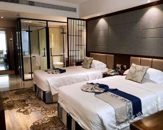 Zhangzhou Yinjia Hotel (Gucheng Branch) - Zhangzhou - Schlafzimmer