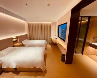 Nanjing Lukou Qiudu Hotel - Nankín - Habitación
