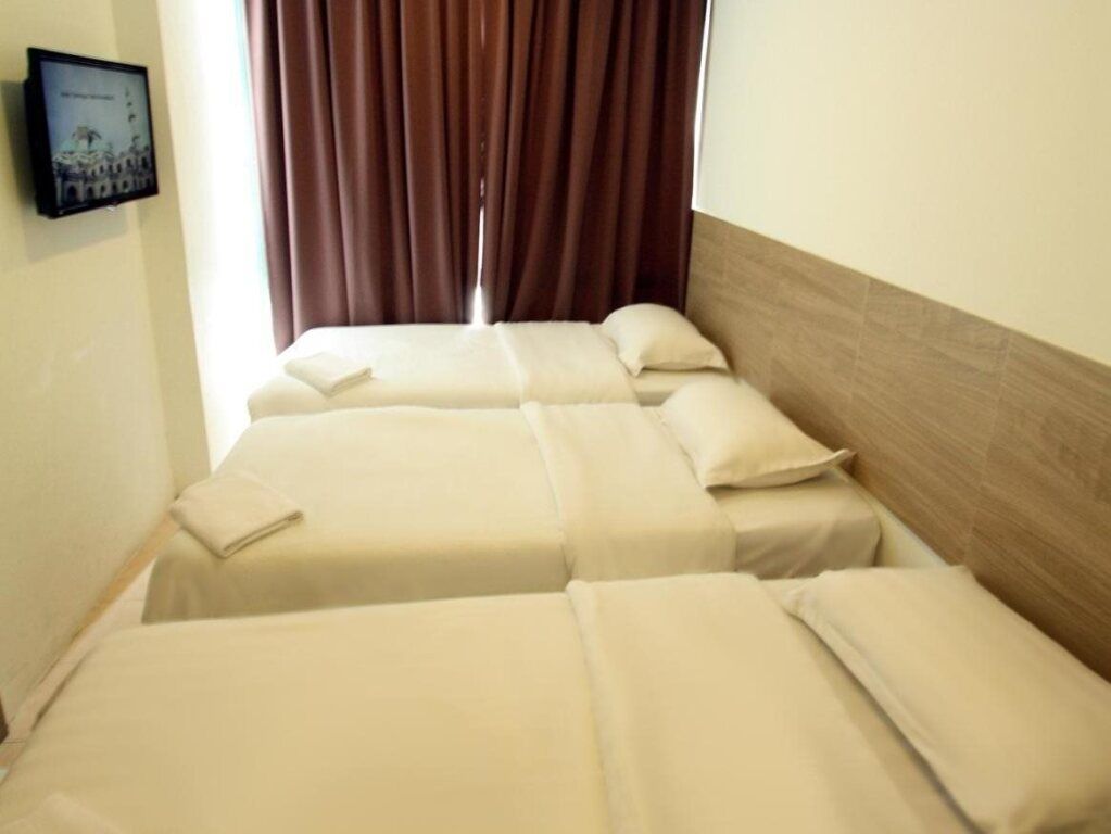 Place2Stay - Airport - קוצ'ינג - חדר שינה