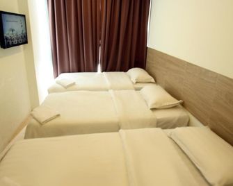 Place2Stay - Airport - קוצ'ינג - חדר שינה
