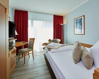 Hotel Königshof - גרמיש-פרטנקירכן - חדר שינה