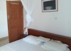 Airport Lodge Lungi - Tulun - Schlafzimmer