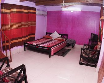 Nilborno Cottage - Srimangal - Habitación