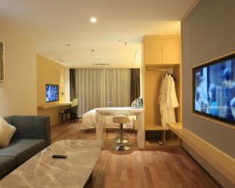 Yongxing Hotel - Chuxiong - Habitación