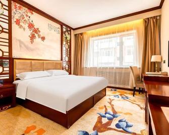 Harbin Baixiang Holiday Hotel - Harbin - Soverom