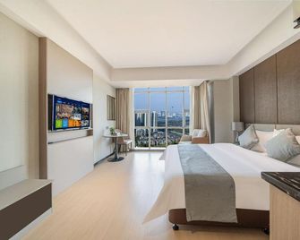 Left Bank International Hotel (Luoyang Museum Suitang Park) - לואויאנג - חדר שינה