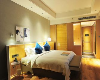Shuiyu Hot Spring Holiday Hotel - Zhumadian - Bedroom