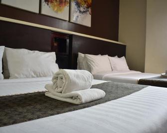 Greenwindows Hotel - דבאו - חדר שינה