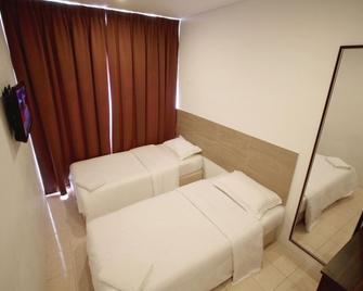 Place2Stay - Airport - Kuching - Habitación